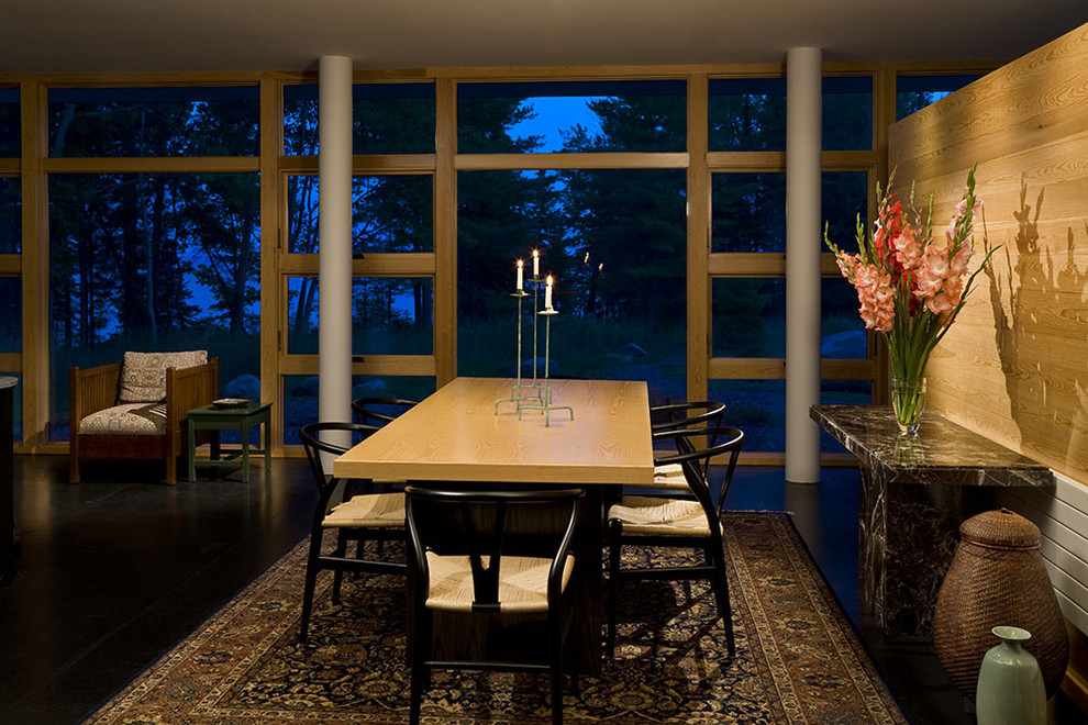 Photo of a modern dining room in Minneapolis with dark hardwood flooring.