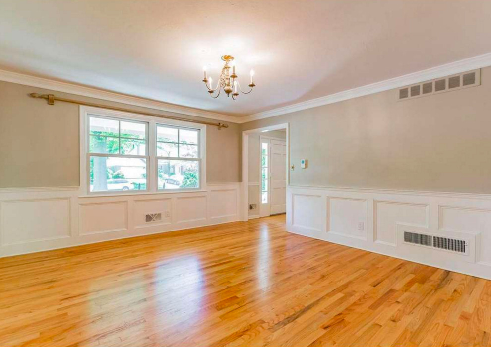 Enclosed dining room - mid-sized contemporary light wood floor enclosed dining room idea in Denver with beige walls