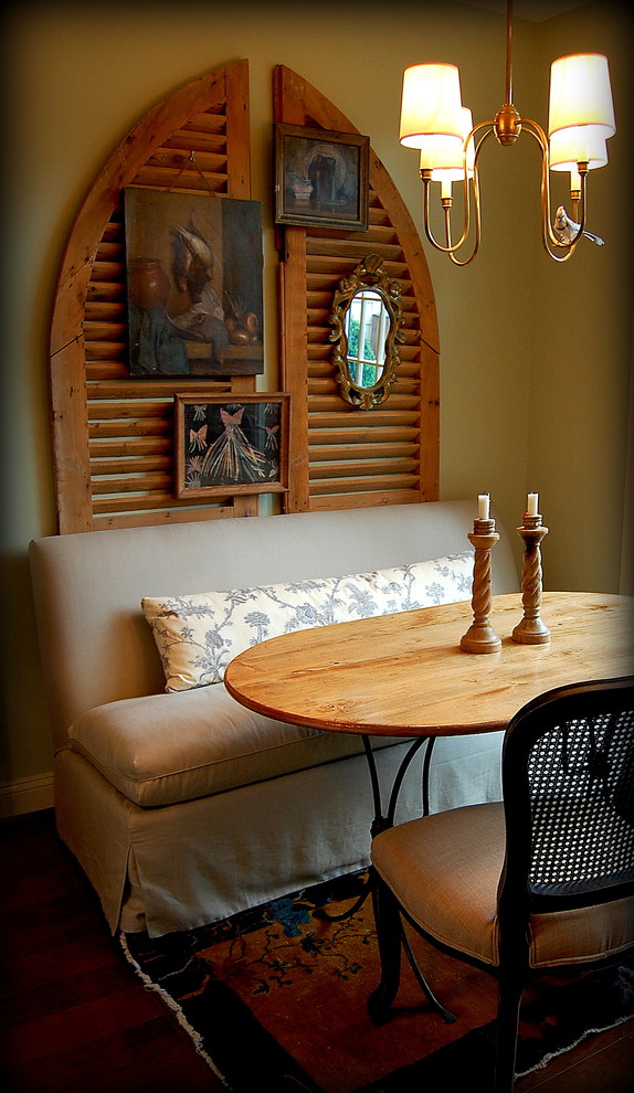 Example of an eclectic dark wood floor dining room design in Richmond with yellow walls
