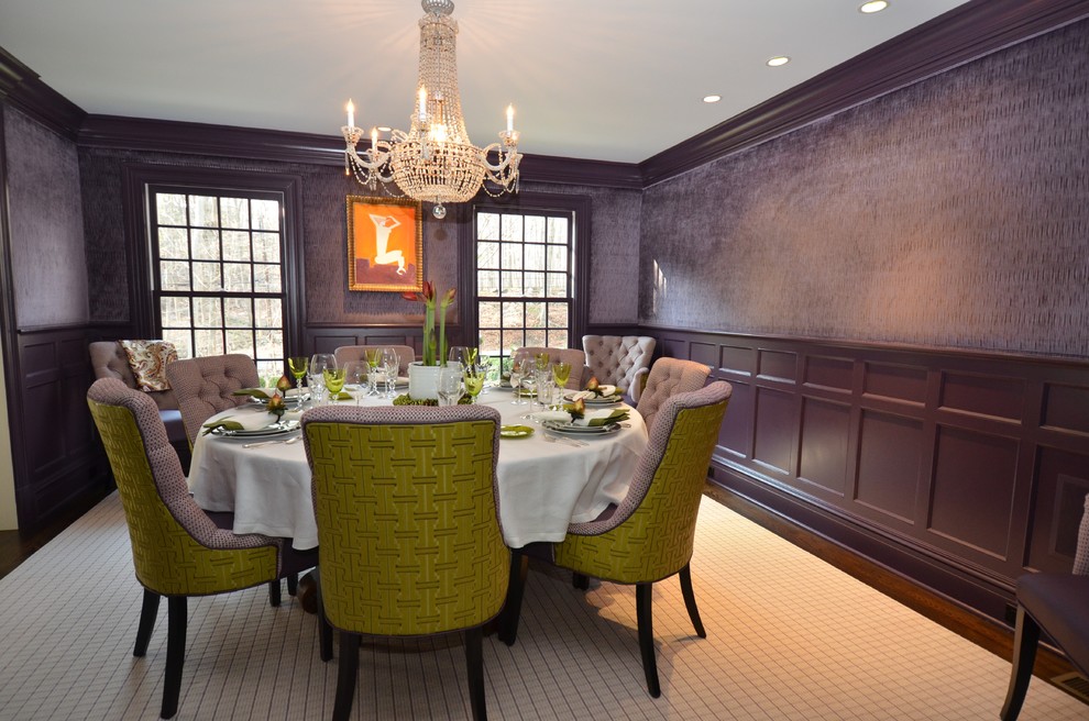 This is an example of a contemporary dining room in New York with grey walls and dark hardwood flooring.
