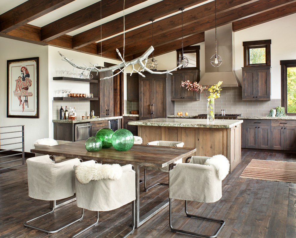 Example of a mountain style dark wood floor kitchen/dining room combo design in Other with white walls
