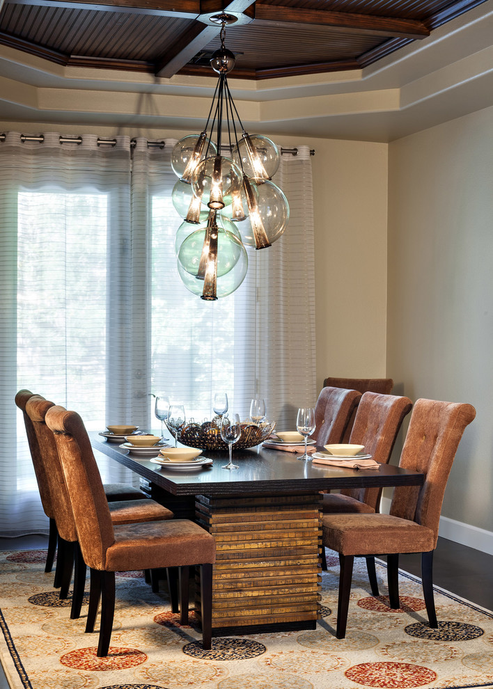 Dining room - contemporary dark wood floor dining room idea in Portland with beige walls