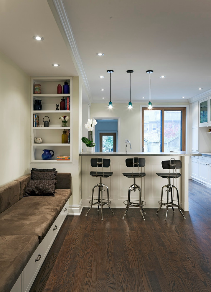 Photo of a contemporary dining room in Toronto with white walls and dark hardwood flooring.