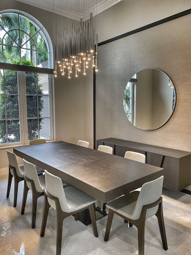 Inspiration for a mid-sized modern porcelain tile and gray floor enclosed dining room remodel in Miami with gray walls and no fireplace