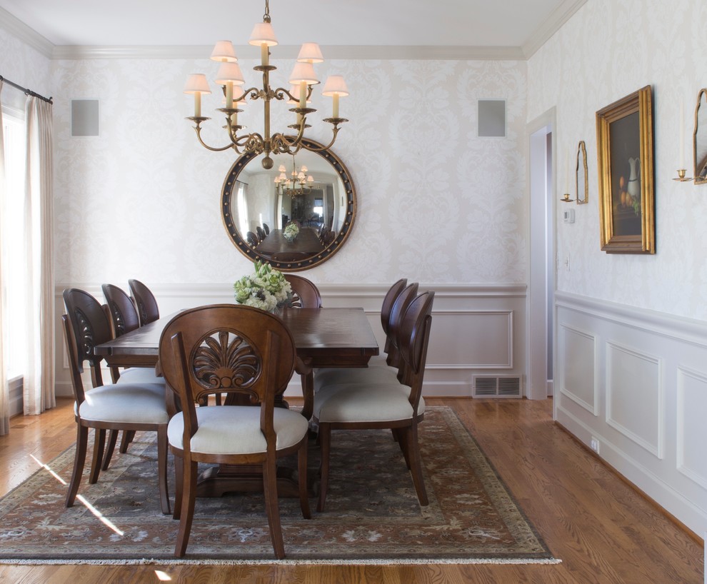 Design ideas for a large traditional enclosed dining room in New York with grey walls, medium hardwood flooring, no fireplace and brown floors.
