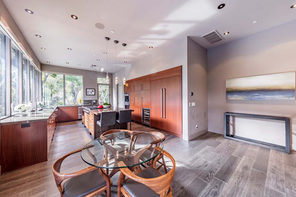 Photo of an expansive contemporary dining room in San Francisco with beige walls, dark hardwood flooring and grey floors.