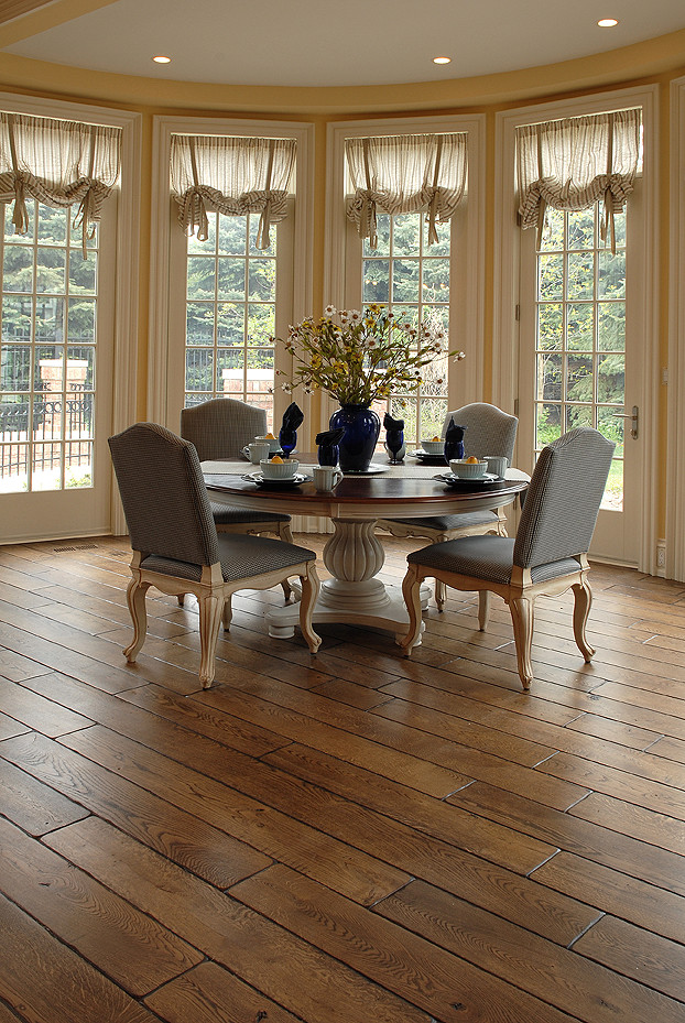Design ideas for a large dining room in Chicago with medium hardwood flooring and brown floors.