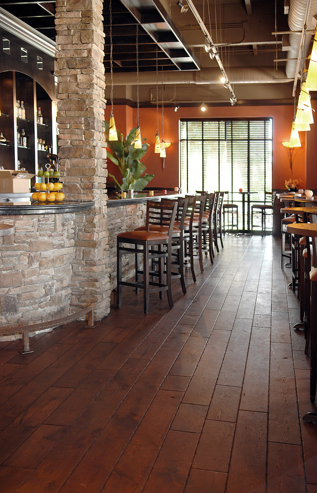 Example of a huge classic dark wood floor and brown floor dining room design in Chicago