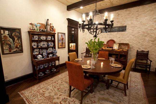 Example of a tuscan dining room design in Dallas