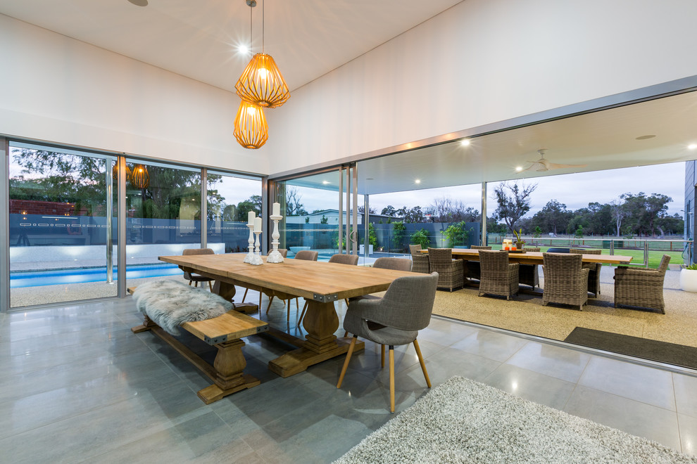Contemporary dining room in Perth with white walls and no fireplace.