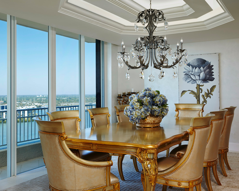 Victorian enclosed dining room in Miami with beige walls and beige floors.