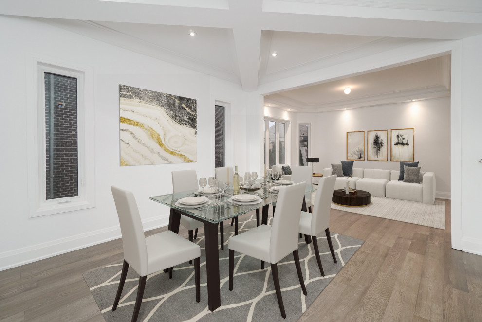 Medium sized contemporary kitchen/dining room in Toronto with white walls, light hardwood flooring and brown floors.