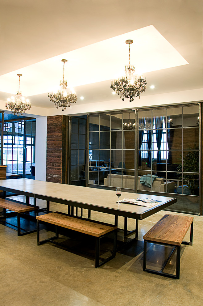 Ispirazione per una grande sala da pranzo design con pareti bianche e pavimento in cemento