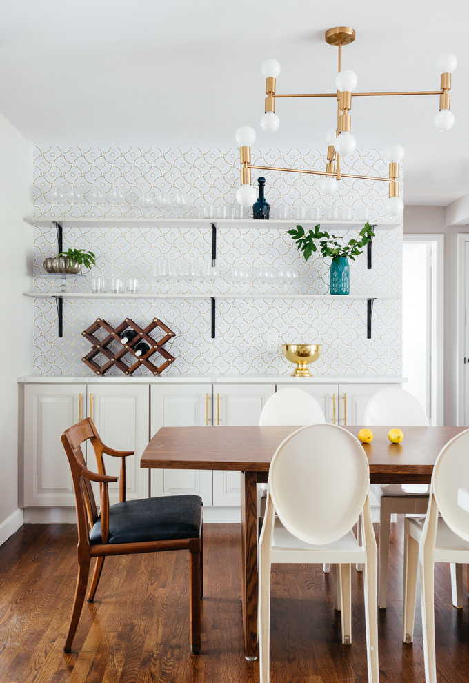 Medium sized traditional dining room in New York with multi-coloured walls, medium hardwood flooring and no fireplace.