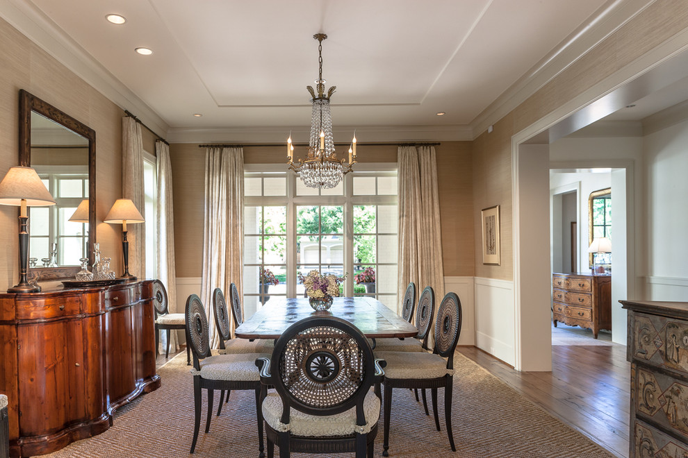 Design ideas for a classic dining room in Houston with beige walls and feature lighting.