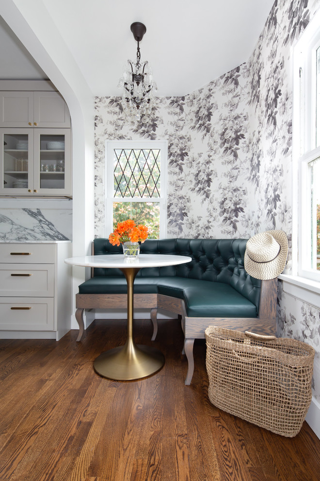 Small traditional kitchen/dining room in Seattle with multi-coloured walls, dark hardwood flooring and brown floors.