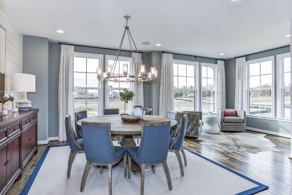 Inspiration for a farmhouse open plan dining room in DC Metro with grey walls, medium hardwood flooring, brown floors and feature lighting.