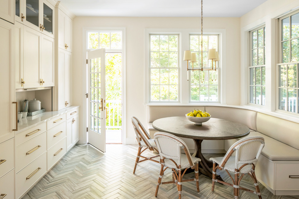 This is an example of a small nautical kitchen/dining room in Portland Maine with ceramic flooring, grey floors, beige walls and no fireplace.