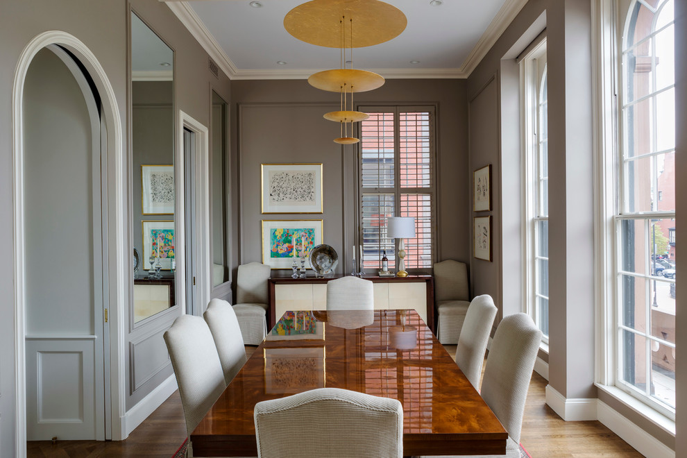 Design ideas for a medium sized classic enclosed dining room in Boston with brown walls, light hardwood flooring, brown floors and no fireplace.
