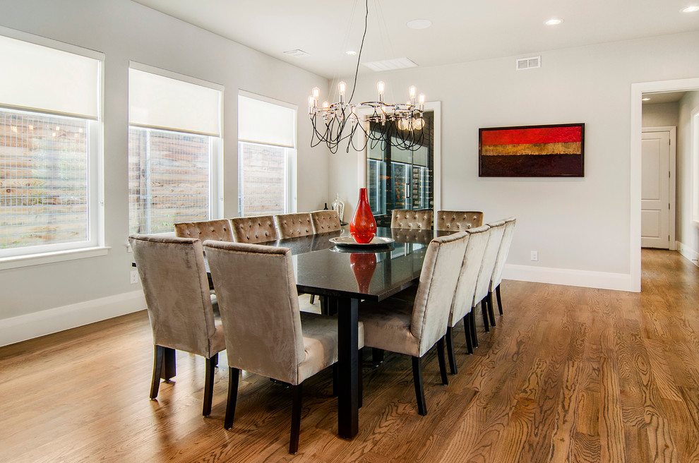 Inspiration for a large contemporary kitchen/dining room in Dallas with grey walls and medium hardwood flooring.