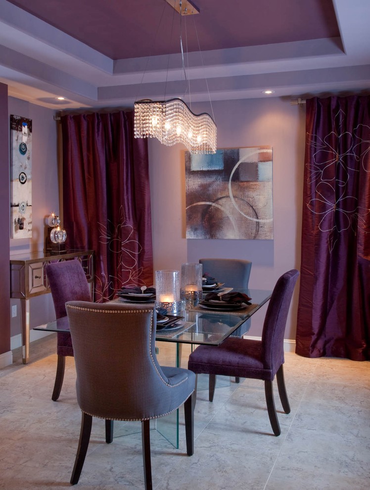 Example of a trendy dining room design in San Diego with purple walls