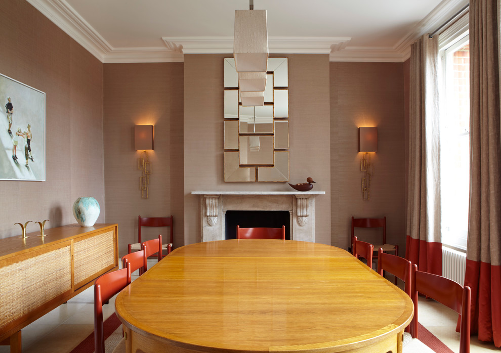 Dining room - contemporary dining room idea in London with brown walls and a standard fireplace