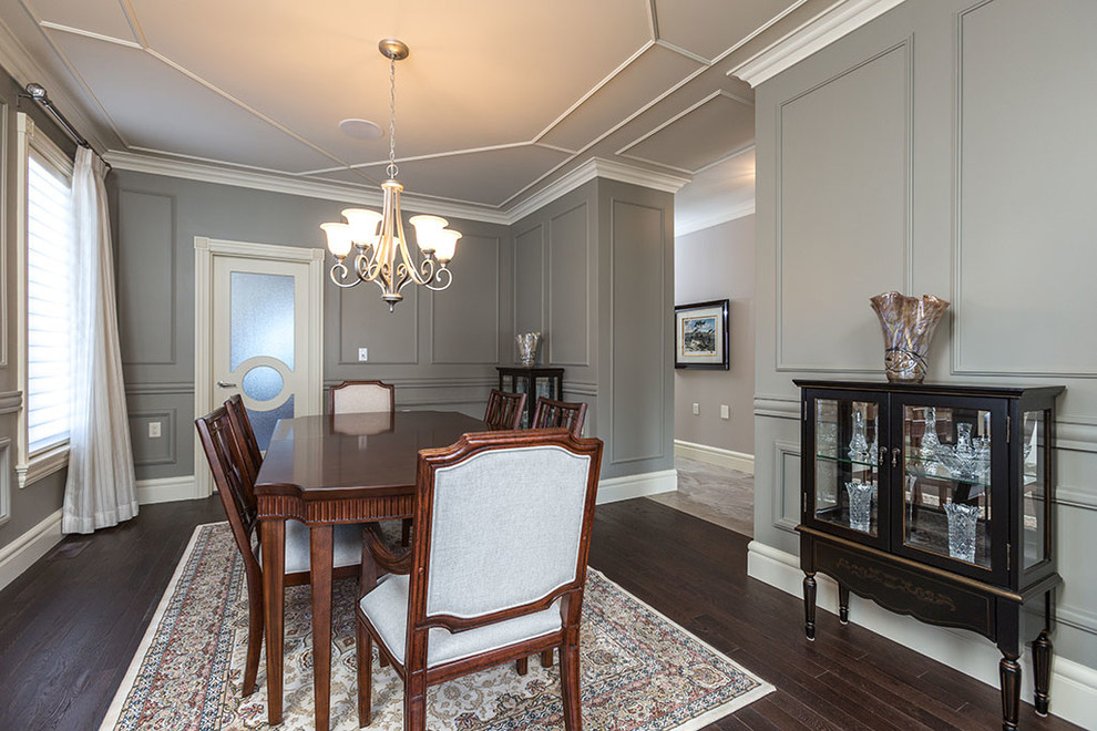 This is an example of a large traditional open plan dining room in Other with grey walls, dark hardwood flooring, no fireplace and brown floors.