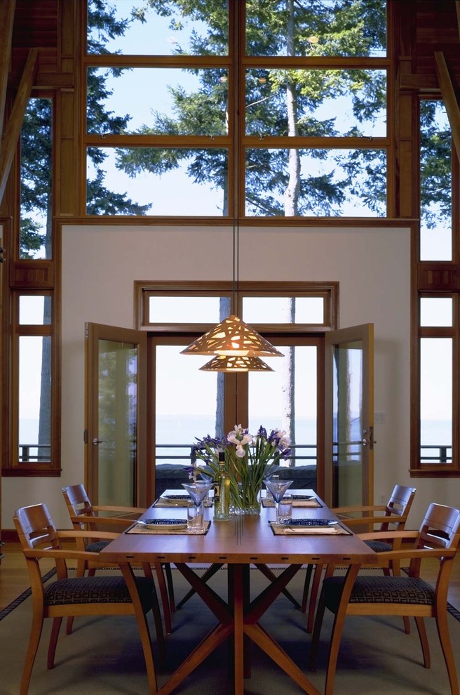 Inspiration for a rustic dining room in Seattle with white walls.