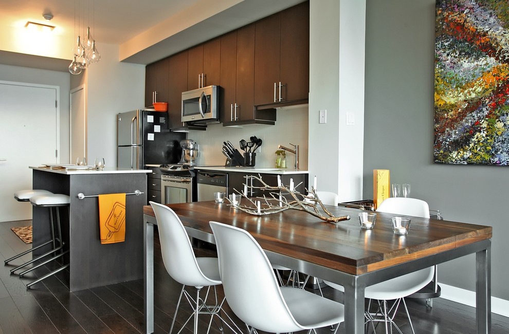 Small contemporary kitchen/dining room in Toronto with grey walls and dark hardwood flooring.
