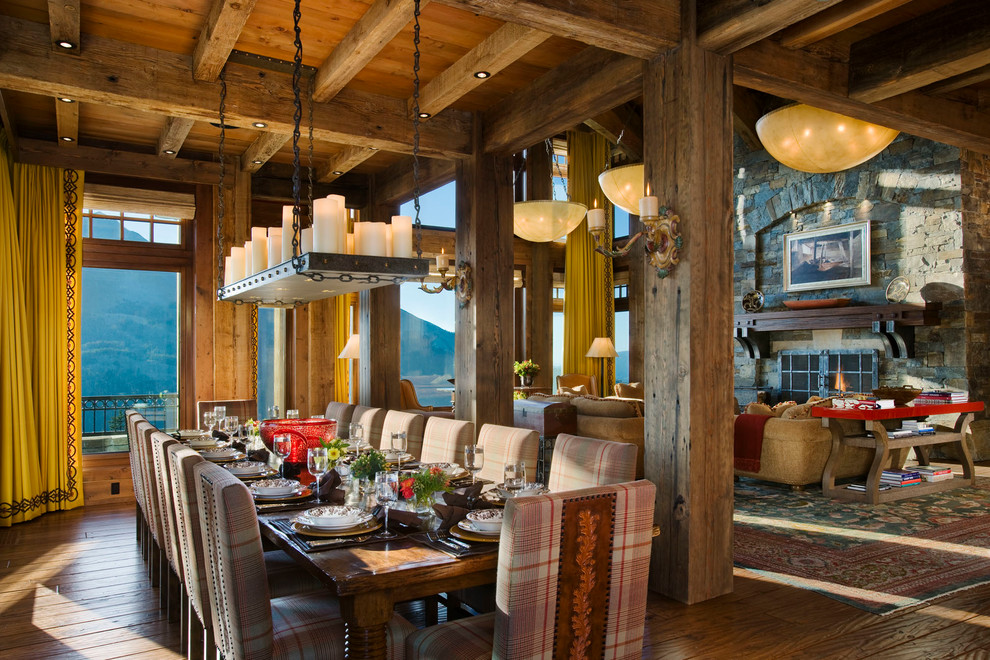 Rustic dining room in Other with feature lighting.