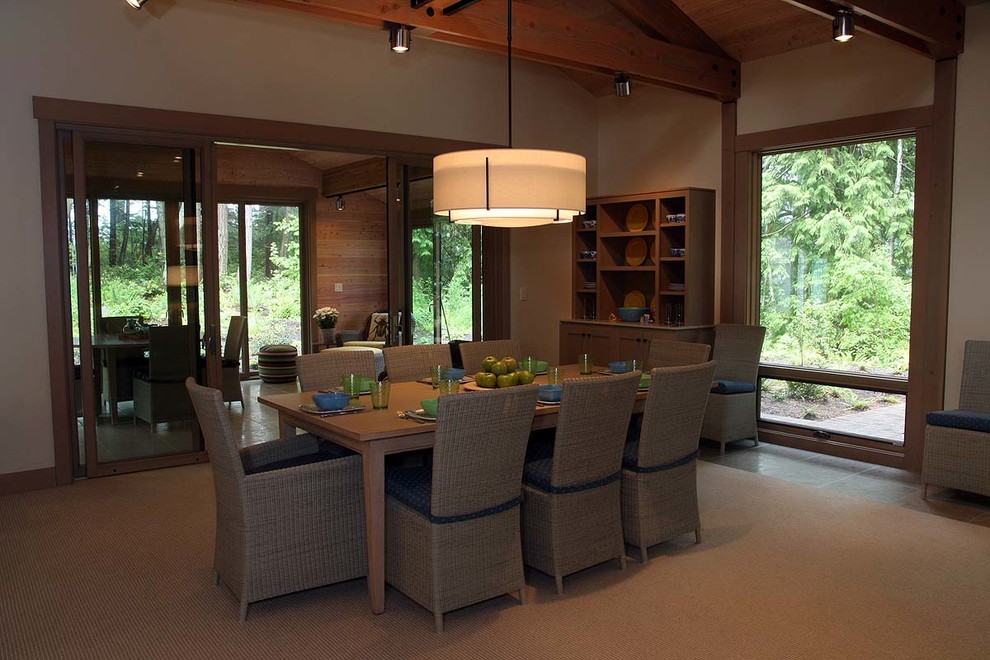 Large mountain style ceramic tile and beige floor enclosed dining room photo in Seattle with beige walls