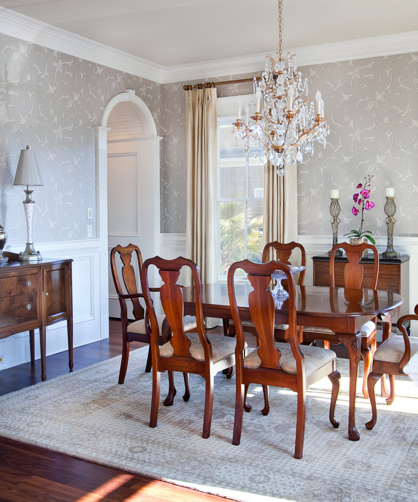 Elegant dark wood floor enclosed dining room photo in Charleston with gray walls