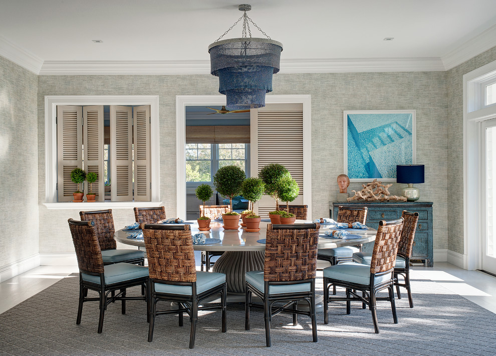 Design ideas for a coastal dining room in New York with grey walls and grey floors.