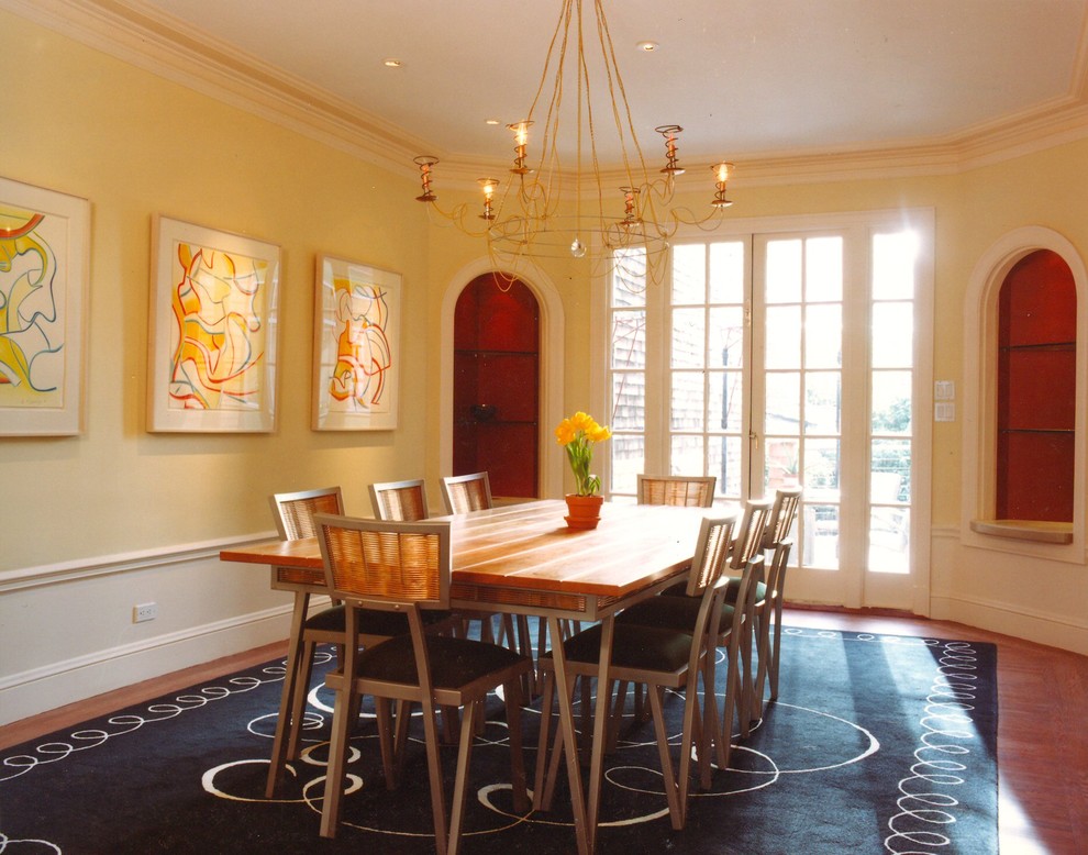 Eclectic dining room photo in San Francisco with yellow walls