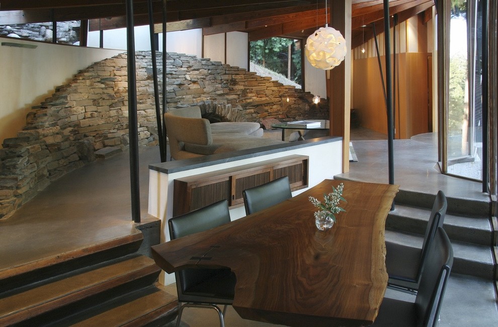 Photo of a contemporary dining room in San Francisco with concrete flooring.