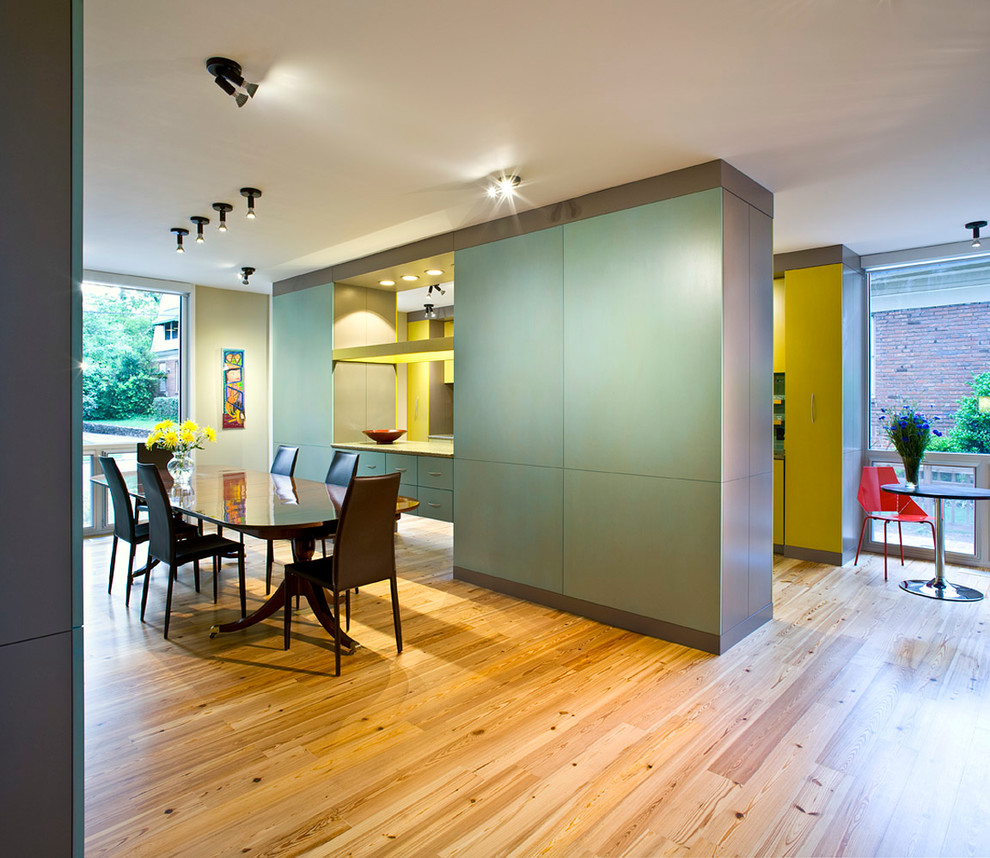 Inspiration for a mid-sized contemporary light wood floor and beige floor great room remodel in Atlanta with beige walls and no fireplace
