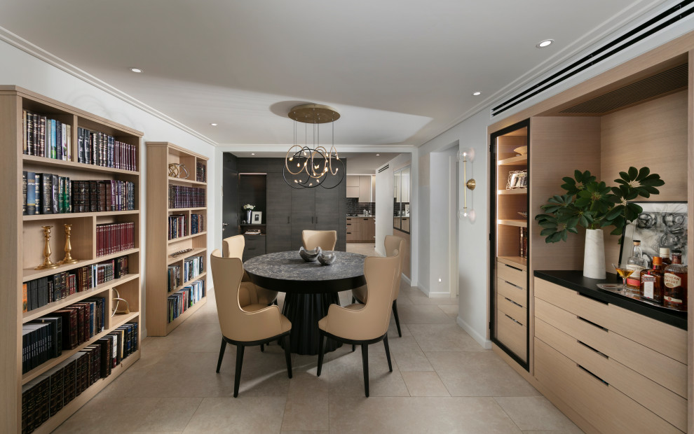 Exemple d'une salle à manger ouverte sur le salon tendance avec un mur gris et un sol en carrelage de porcelaine.