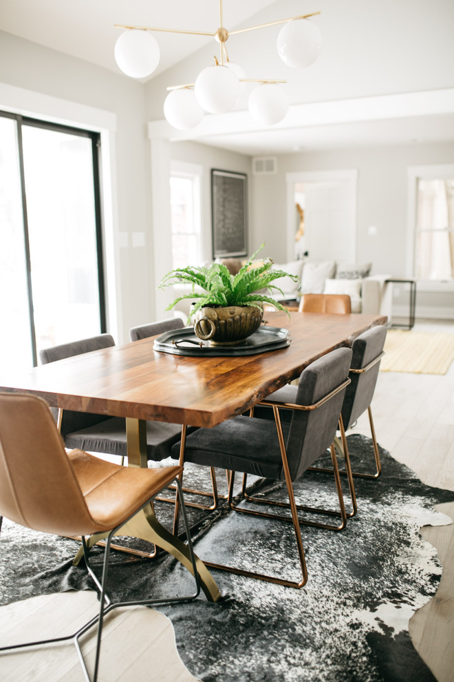 Design ideas for a country enclosed dining room in Indianapolis with grey walls, light hardwood flooring and beige floors.