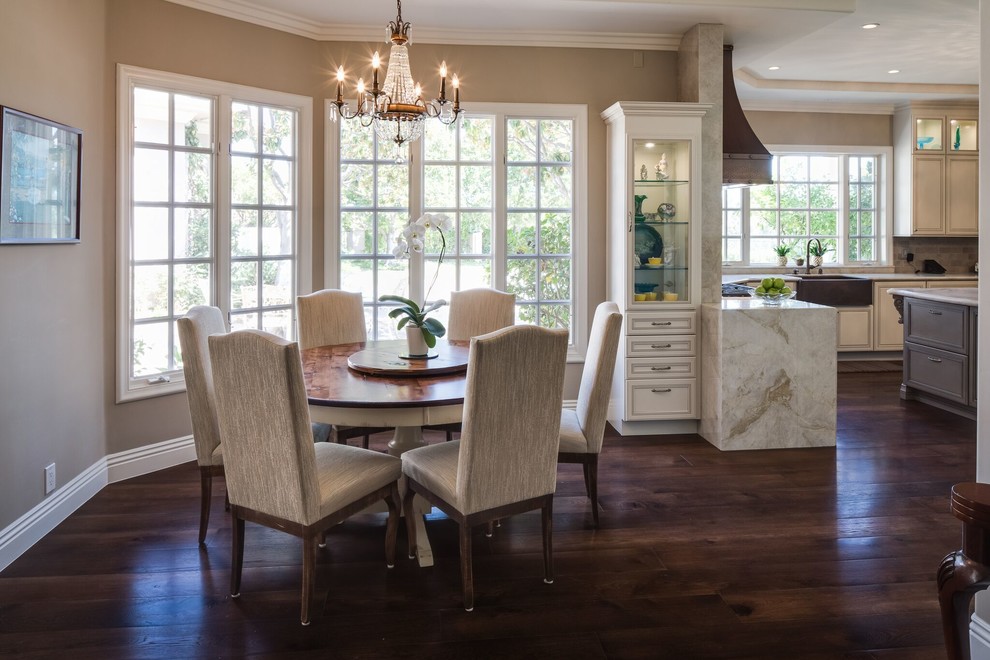Kitchen/dining room combo - mid-sized traditional dark wood floor and brown floor kitchen/dining room combo idea in San Diego with brown walls