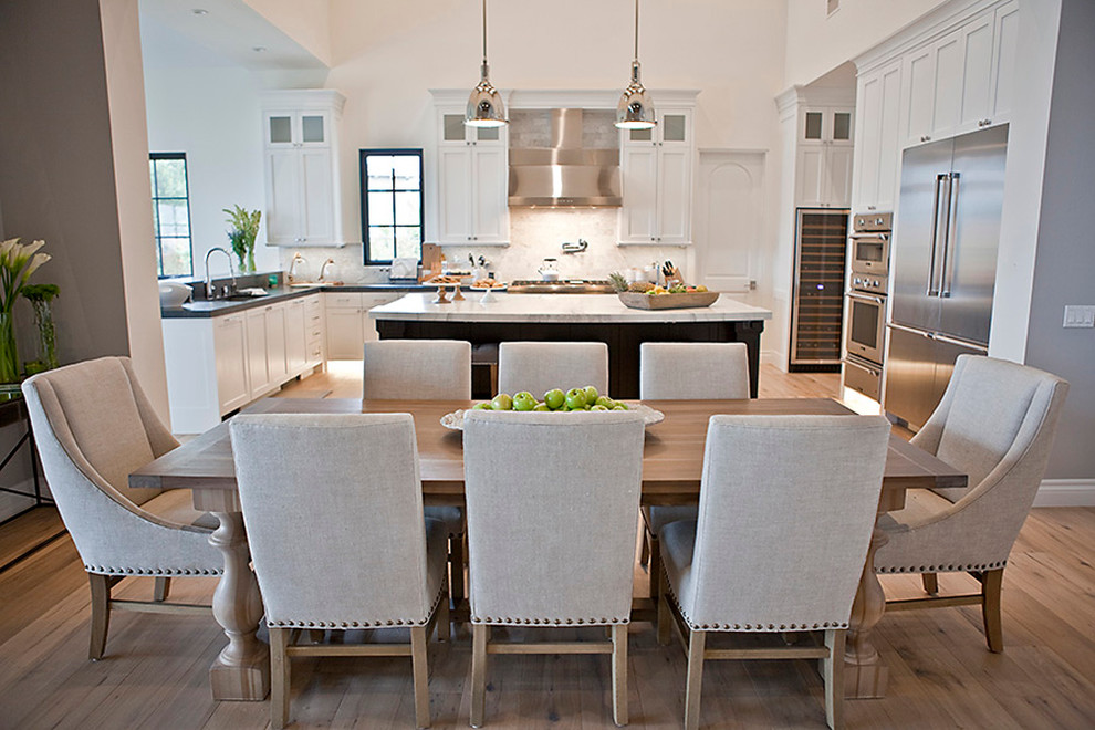 Design ideas for a large classic kitchen/dining room in San Diego with white walls and light hardwood flooring.