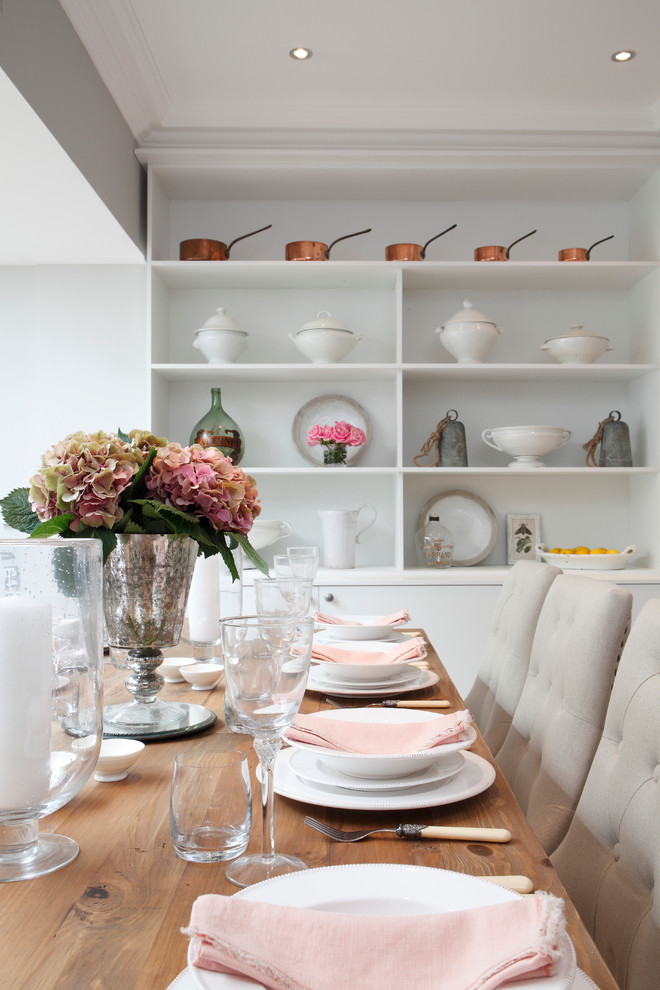 Photo of a traditional dining room in London with grey walls.