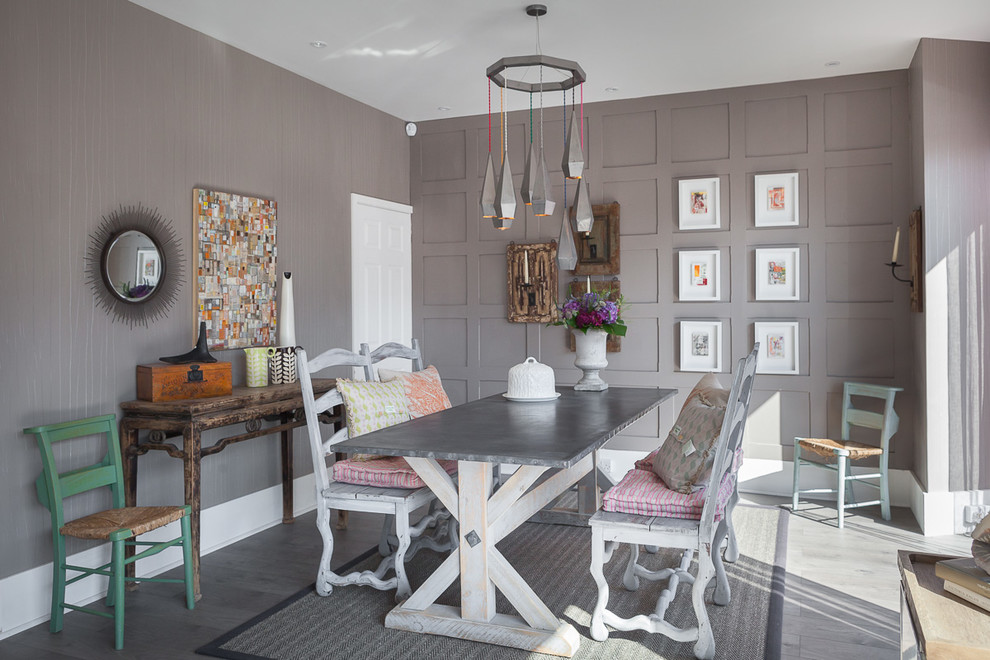 Inspiration for a medium sized bohemian enclosed dining room in Sussex with grey floors.