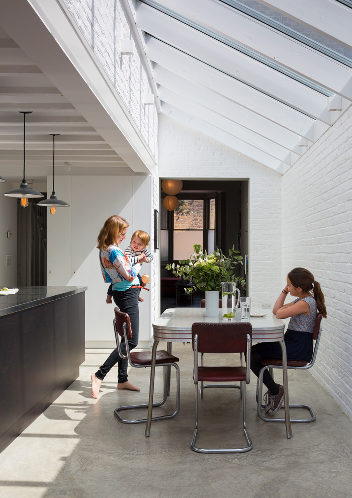 Photo of a contemporary dining room in London.