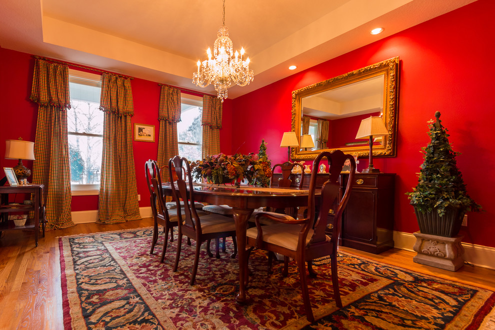 Example of a large classic light wood floor great room design in Orlando with red walls