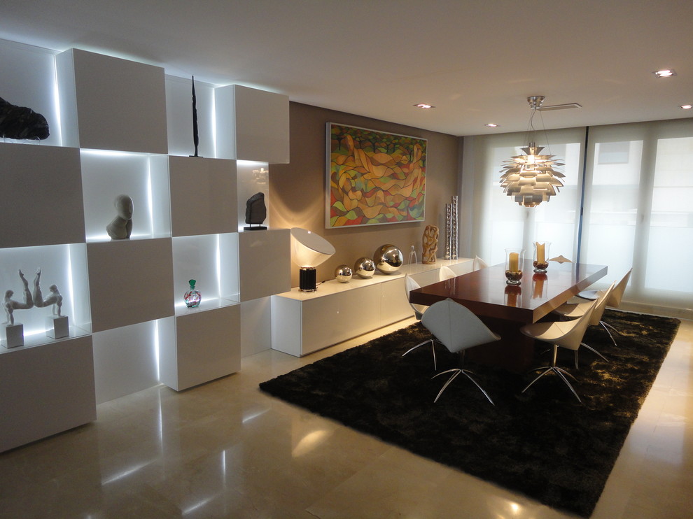 This is an example of a large modern dining room in Madrid with white walls, travertine flooring, no fireplace and feature lighting.