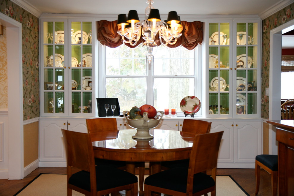 Medium sized classic kitchen/dining room in New York with multi-coloured walls and medium hardwood flooring.