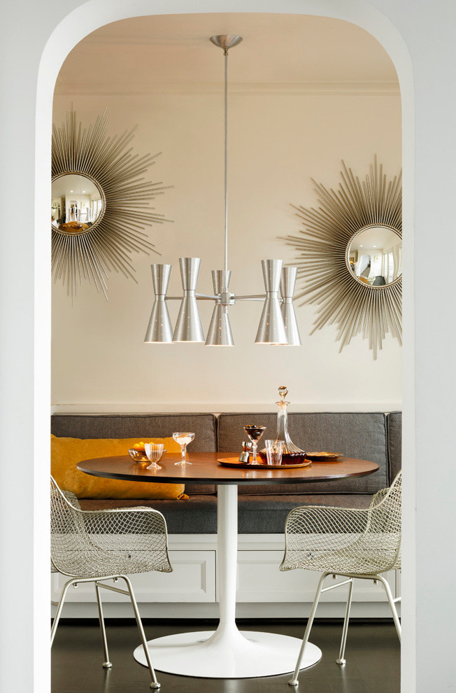 This is an example of a retro dining room in Portland with beige walls.