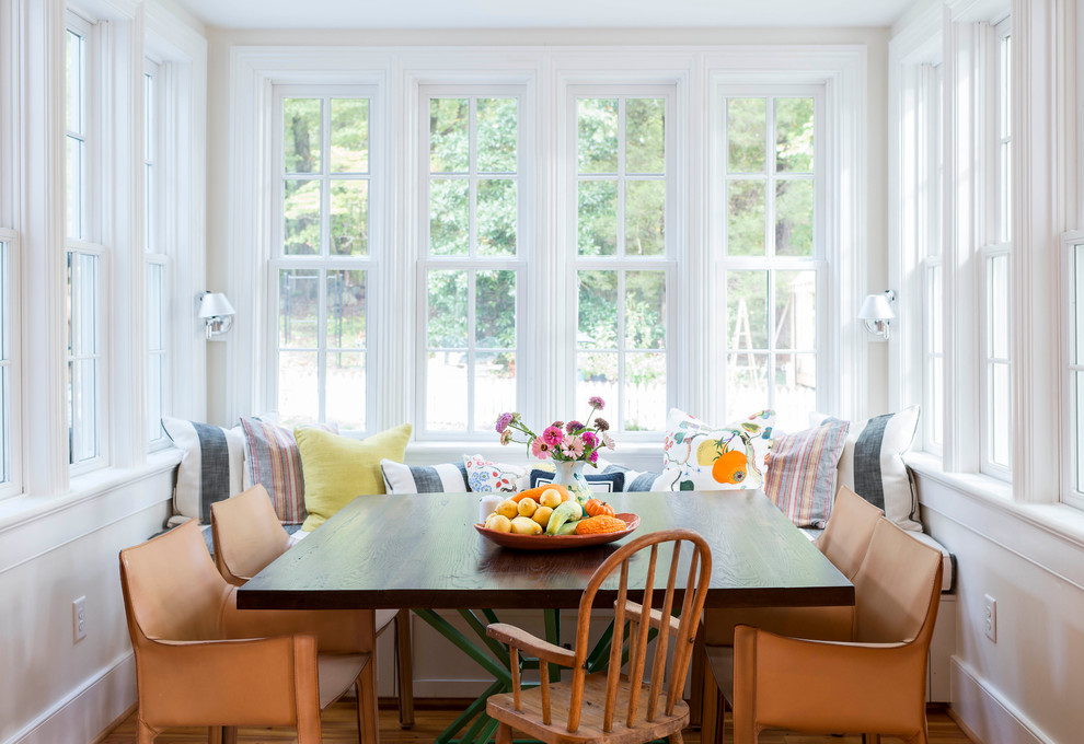 This is an example of a farmhouse dining room in Charlotte with beige walls.