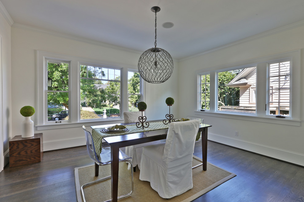 Inspiration for a medium sized traditional kitchen/dining room in Portland with white walls and dark hardwood flooring.