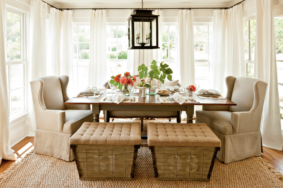 Dining room - farmhouse medium tone wood floor dining room idea in Atlanta with white walls